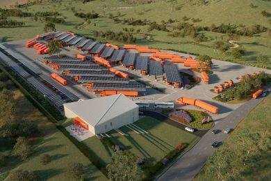 Aerial view of the planned heavy vehicle charging depot at Wilton, with trucks parked under solar canopies